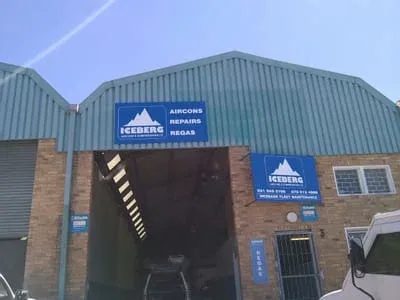 The Iceberg workshop on Kouga Street, signage reading Aircons, Repairs, Regas
